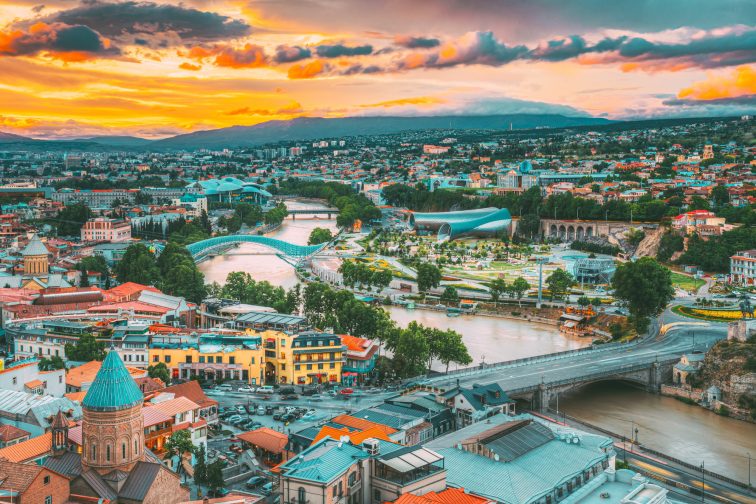 Tbilisi, Georgia. Evening View Of Tbilisi Skyline At Colorful Sunset. Summer Cityscape